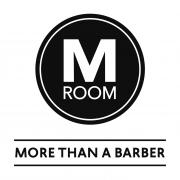 Logo van M Room met de tekst More Than a Barber onder de naam, in een cirkelvormig ontwerp.