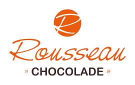 Rousseau Chocolade logo met oranje R in een cirkel en jaartal 1969.
