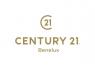 Century 21 Benelux logo met goudkleurige tekst en een gestileerd cijfervormig embleem.