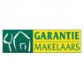 Logo van Garantiemakelaars met een groene achtergrond, een witte huislijntekening en gele tekst.