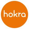 Het logo van Hokra met witte letters in een oranje cirkel.