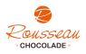Rousseau Chocolade logo met oranje R in een cirkel en jaartal 1969.