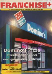 Voorpagina van Franchise+ juni 2002 met focus op Domino’s Pizza's groeiambities naar 10.000 vestigingen wereldwijd.