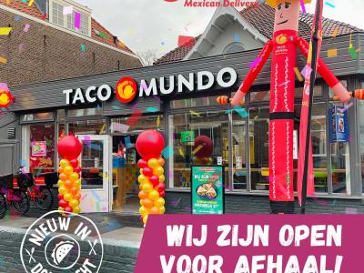 Taco Mundo vestiging in Dordrecht met feestelijke versiering en aankondiging van opening voor afhaal.