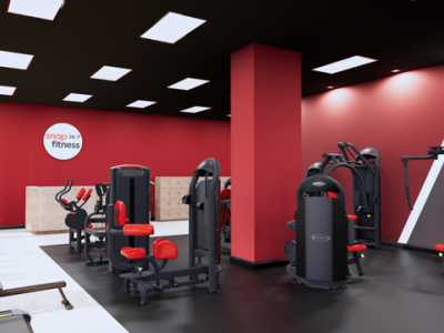 Interieur van Snap Fitness Den Haag met fitnessapparatuur en rode muren.
